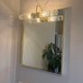Gold framed mirror with integrated light vanity Image 2