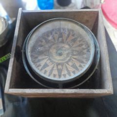 Antique Large Ships Nautical Compass, models were produced by firms like Francis M. Moore Dublin & Belfast active 1854 to 1894 or Henry Hughes & Son of London., as indicated by the style of the compass rose and the gimbaled mounting in a wooden bo
