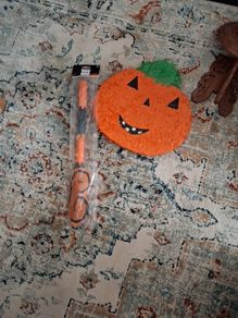 Halloween Pinata with stick and mask.