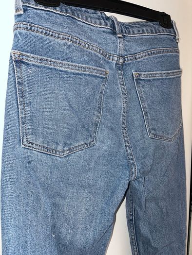 Distressed blue jeans