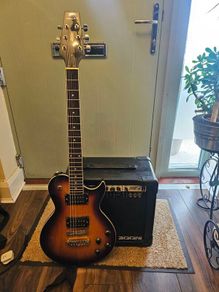 Aria electric guitar with Zoom Fire-15 Amp