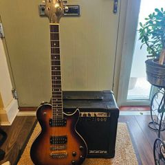 Aria electric guitar with Zoom Fire-15 Amp
