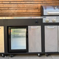 Barbeque with fridge and sink .