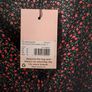Missguided dress features a ditsy floral print on a black background with button detailing. New with Tags. Image 6