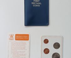 Britain's first decimal coins set in a blue wallet