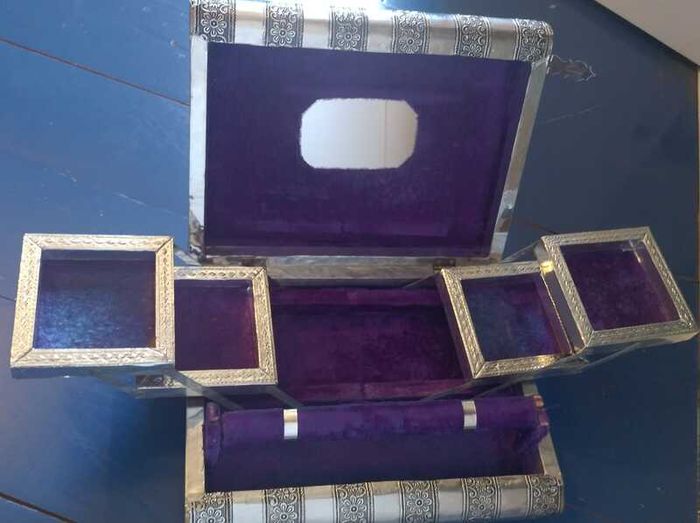 Book-shaped silver jewellery box with purple velvet lining