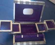 Book-shaped silver jewellery box with purple velvet lining