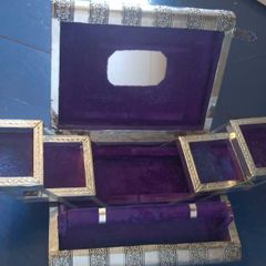 Book-shaped silver jewellery box with purple velvet lining