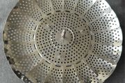 This is a collapsible stainless steel steamer basket