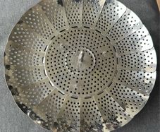 This is a collapsible stainless steel steamer basket