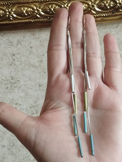 Silver tone chain earrings.