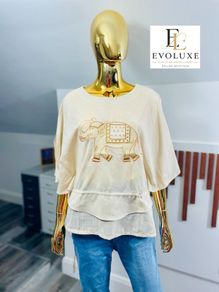stunning elephant embroidery to the lightweight, textured drape and split-sleeve design this top is a wardrobe must-have.