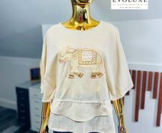 stunning elephant embroidery to the lightweight, textured drape and split-sleeve design this top is a wardrobe must-have.