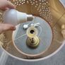 Brass effect table lamp with pink shade (removable) Image 2