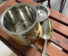 Ice bucket for champagne with silver spoon