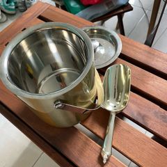 Ice bucket for champagne with silver spoon