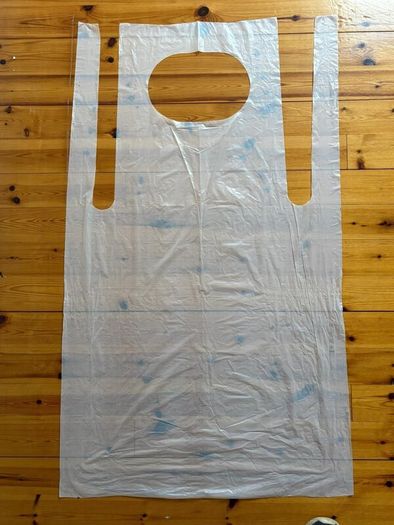 White Disposable Aprons on a roll of 200