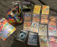 Pokemon Card Bundle EX/GX + Sleeves + Charizard Tin