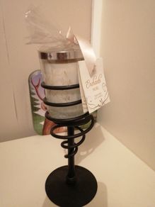 candle with wrought-iron holder.