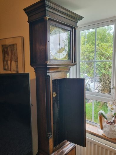 A Georgian grandfather clock made by the English clockmaker John Rogers of Leominster