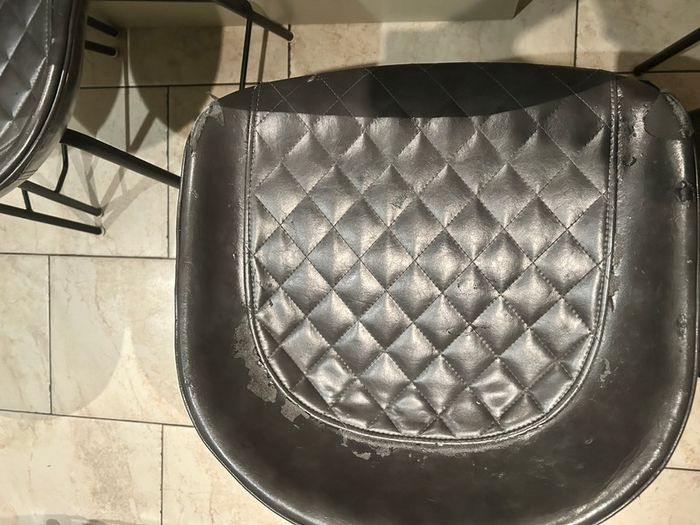 Three  black quilted kitchen bar stools