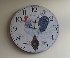 Vintage-style pendulum clock with rooster