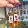 Mini Spiced Rum Bottle Drop Earrings. Image 3