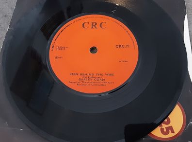 irish pressed single,  men behind the wire