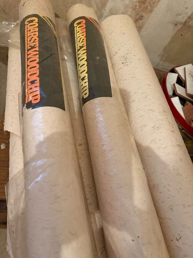 Free: Rolls of coarse wood chip wallpaper