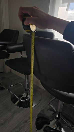 Adjustable black faux leather swivel bar stool with a metal base x3