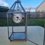 Table clock in a glass lantern. Image 5