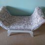 End of bed upolstered seat with curved arms, grey and beige floral pattern. Image 2
