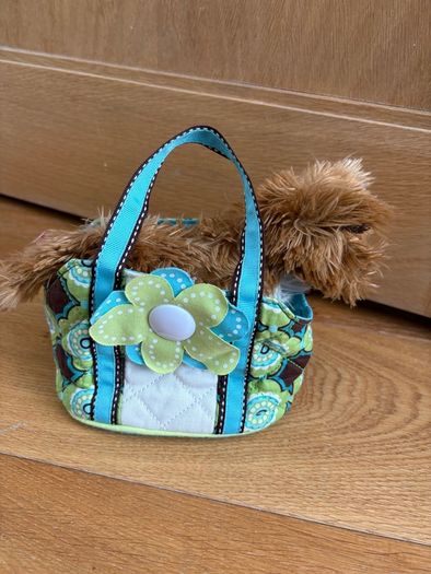 Dog stuffed animal in bag