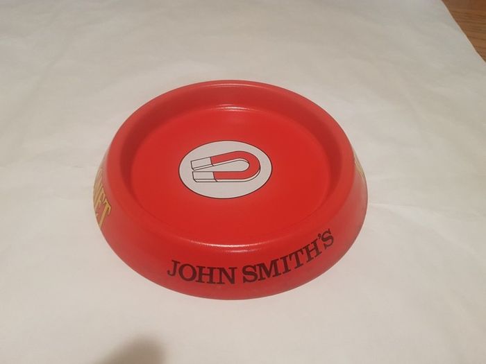 john smiths metal ashtray,great colour and advertising ,collectors item, price includes post to anywhere in ireland thank you