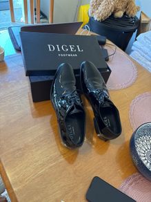 High gloss black shoes worn once for a wedding.
