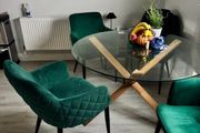 Glass table with velvet green chairs