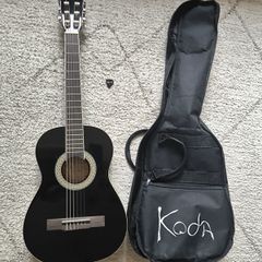 Koda black guitar 1/2 size, includes bag and pick