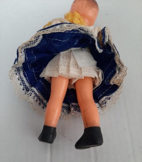 Small vintage rubber doll in costume