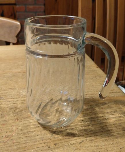 Luminarc glass pitcher with a ribbed design.