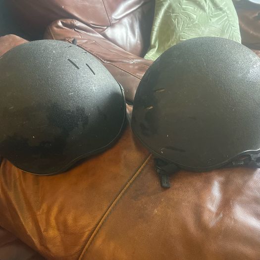 Two child's horse riding helmets