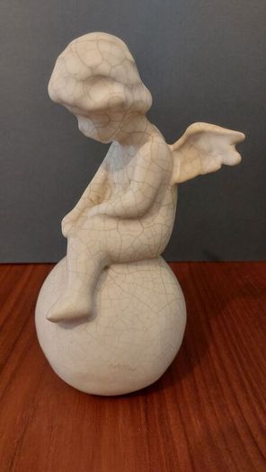 Lovely Vintage Pair of Ceramic Baby Winged Angels Sitting on Globes with a Very Tactile Cream Coloured Crackle Glaze
