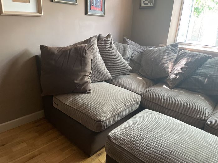 L shaped couch with poof