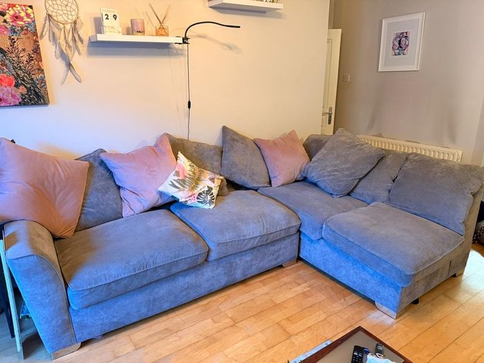 Grey corner couch incl. matching pouffe