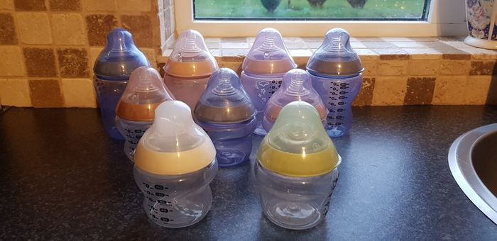 Tomee Tippee bottles, new soothers, bottle thermal holders x 2 and formula measure containers