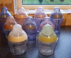 Tomee Tippee bottles, new soothers, bottle thermal holders x 2 and formula measure containers