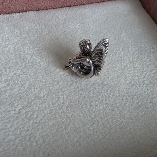 Pandora sitting pixie charm with 14k yellow gold heart  very good condition hallmarked