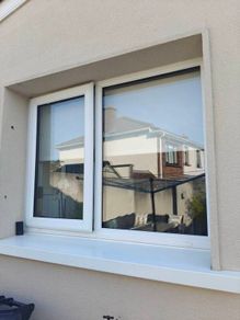 White uPVC Window and Roller Blind.