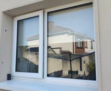 White uPVC Window and Roller Blind.