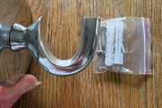 Large silver coloured hanging hook with screws and raw plugs