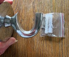 Large silver coloured hanging hook with screws and raw plugs